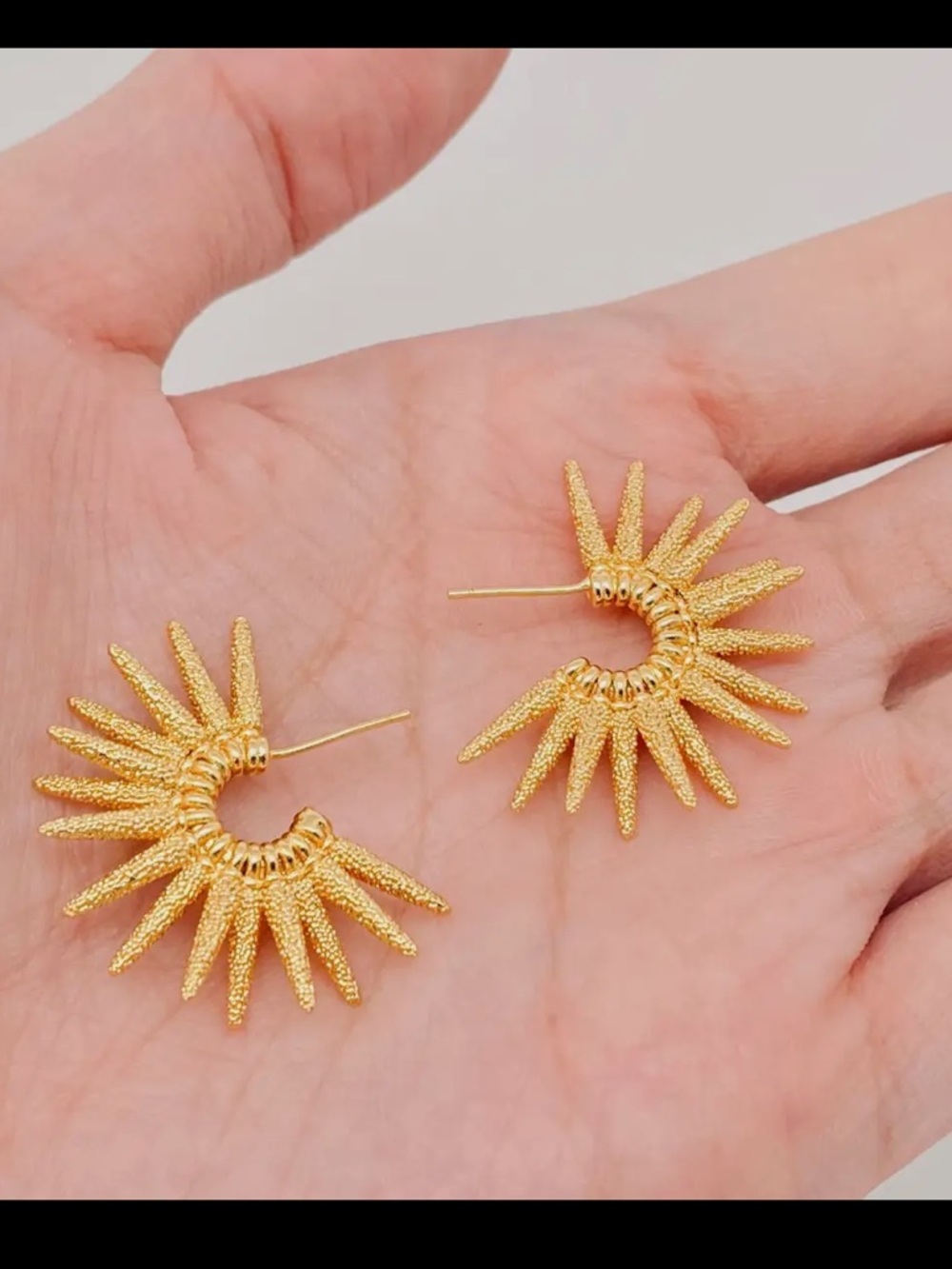 261. C shaped spiked hoop gold pleated earrings